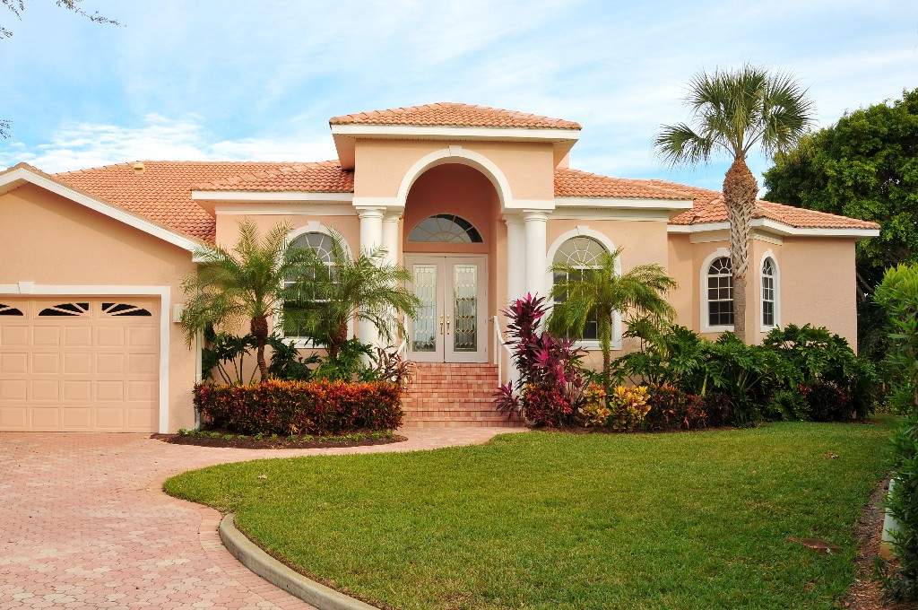 Florida style home with palm trees